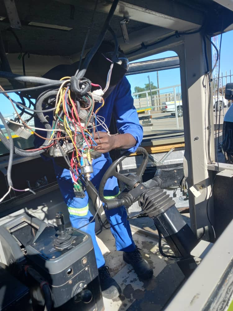 Local service technician working on equipment